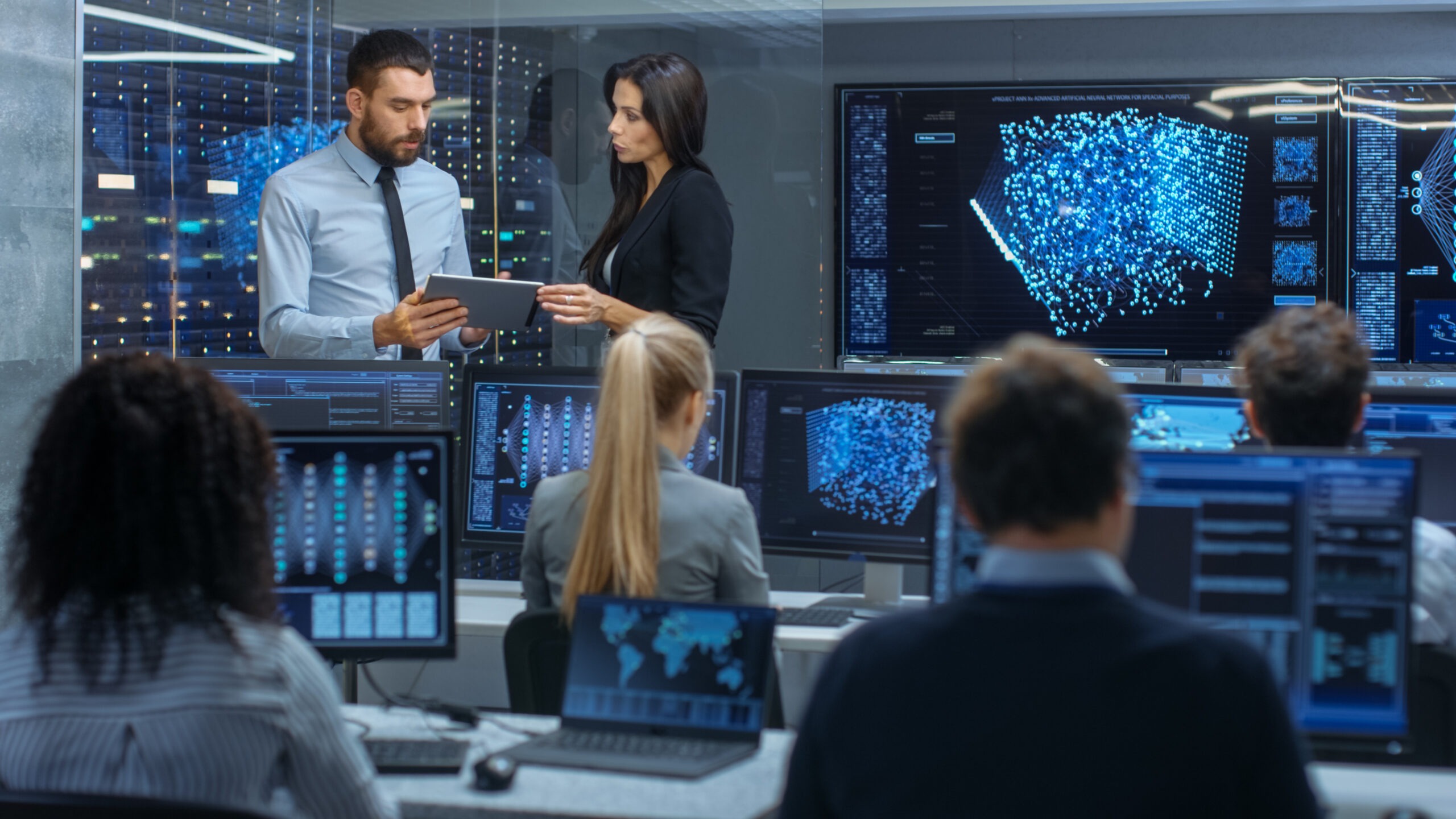 Head of the Department and Project Manager Discuss Work Process Using Data on Tablet Computer